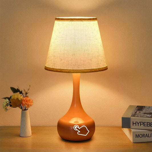 2-piece set of three level dimming small table lamps on wooden surface with fabric shades