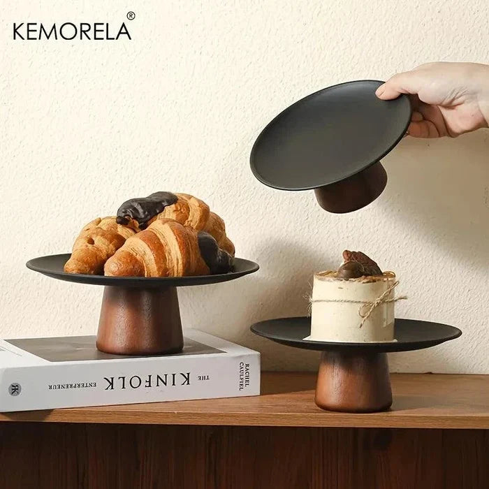 Round acacia wood cake stand with a natural solid finish and footed base