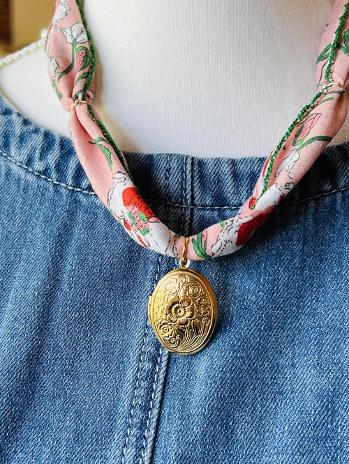 “Locket & Layers” – Close-up of gold locket against colorful bandana cord

“Color Crush” – Necklace styled flat lay with sunglasses and a vintage tee

“Boho Beauty” – Model wearing necklace with flowy top and tousled waves