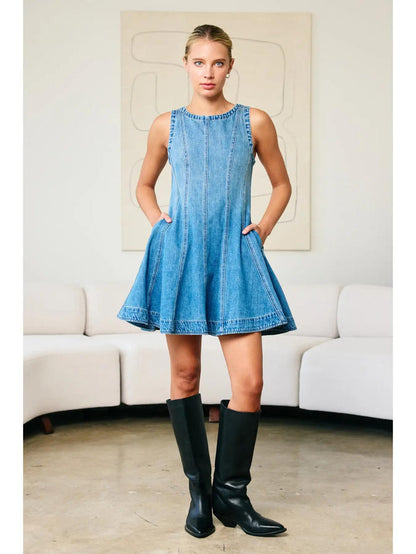 "Fall Layers Favorite" – Denim dress styled with a cream turtleneck and ankle boots

"Pocket Full of Pretty" – Close-up of side pocket detail on flared denim skirt

"Zip & Twirl" – Back view showcasing the zipper and flowy silhouette in motion