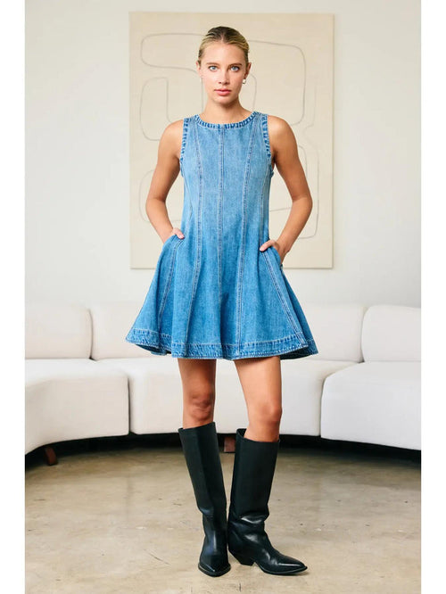"Fall Layers Favorite" – Denim dress styled with a cream turtleneck and ankle boots

"Pocket Full of Pretty" – Close-up of side pocket detail on flared denim skirt

"Zip & Twirl" – Back view showcasing the zipper and flowy silhouette in motion