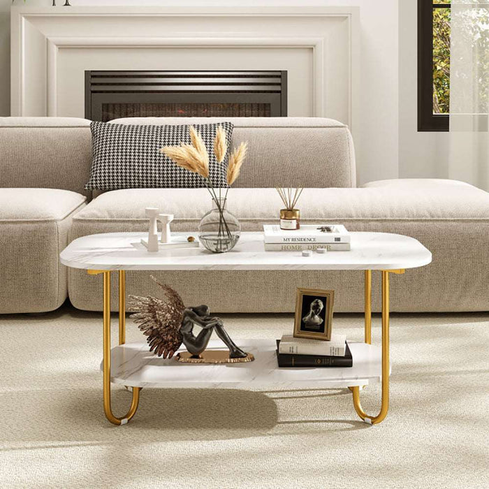 Modern 2-tier faux marble top coffee table with gold metal frame and lower shelf for storage in living room setting