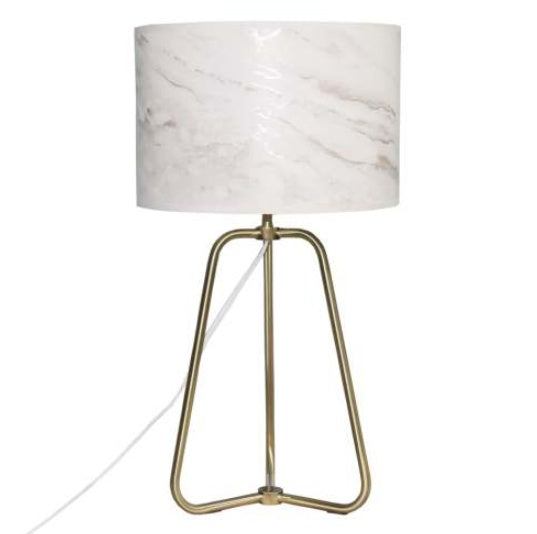 Small modern stylish desk lamp with marble-patterned shade and bronze base on wood table