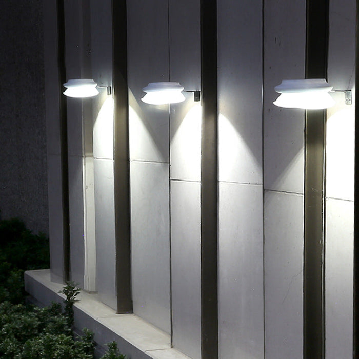 Modern outdoor fence wall lamp mounted on garden fence, weatherproof patio lighting fixture