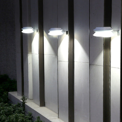 Modern outdoor fence wall lamp mounted on garden fence, weatherproof patio lighting fixture