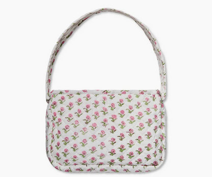 Small quilted shoulder bag in vibrant pink and green floral block print, lightweight cotton purse with zipper closure for daily use.