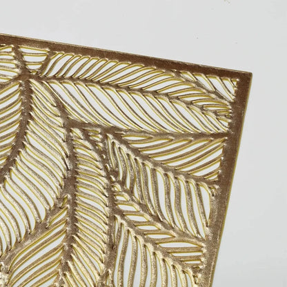 Golden rectangle table mat with hollow leaf design made of durable PVC and vinyl